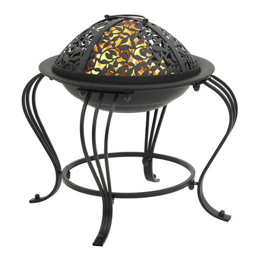The steel fire pit with a decorative leaf pattern lid and the poker tool resting beside it