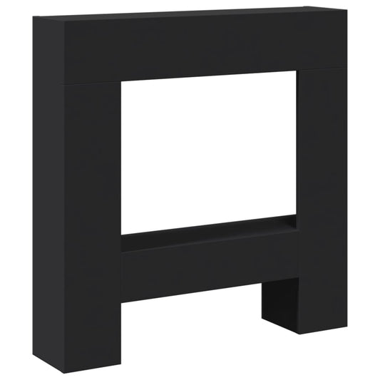 The black fireplace surround, a simple rectangular frame with a central opening