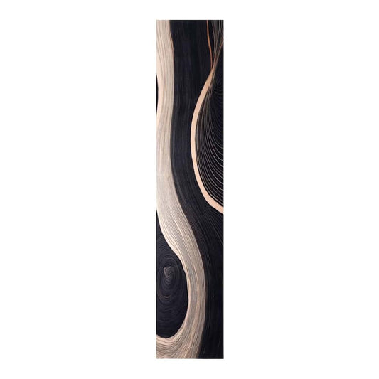 Close-up of the black kitchen rug with swirling cream and grey lines