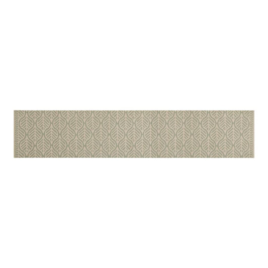 The kitchen rug laid flat showing the full length and leaf pattern