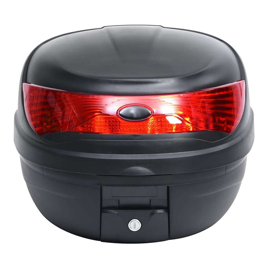 The motorbike top case seen from the front, showing the red reflector and lock