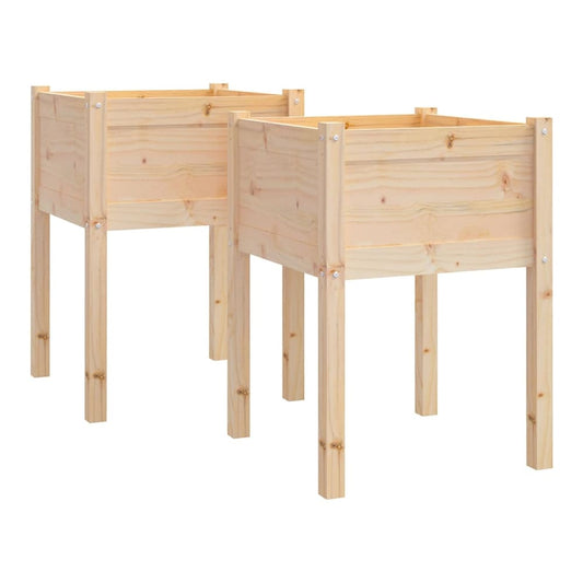 Two wooden planters with legs side by side on a lawn