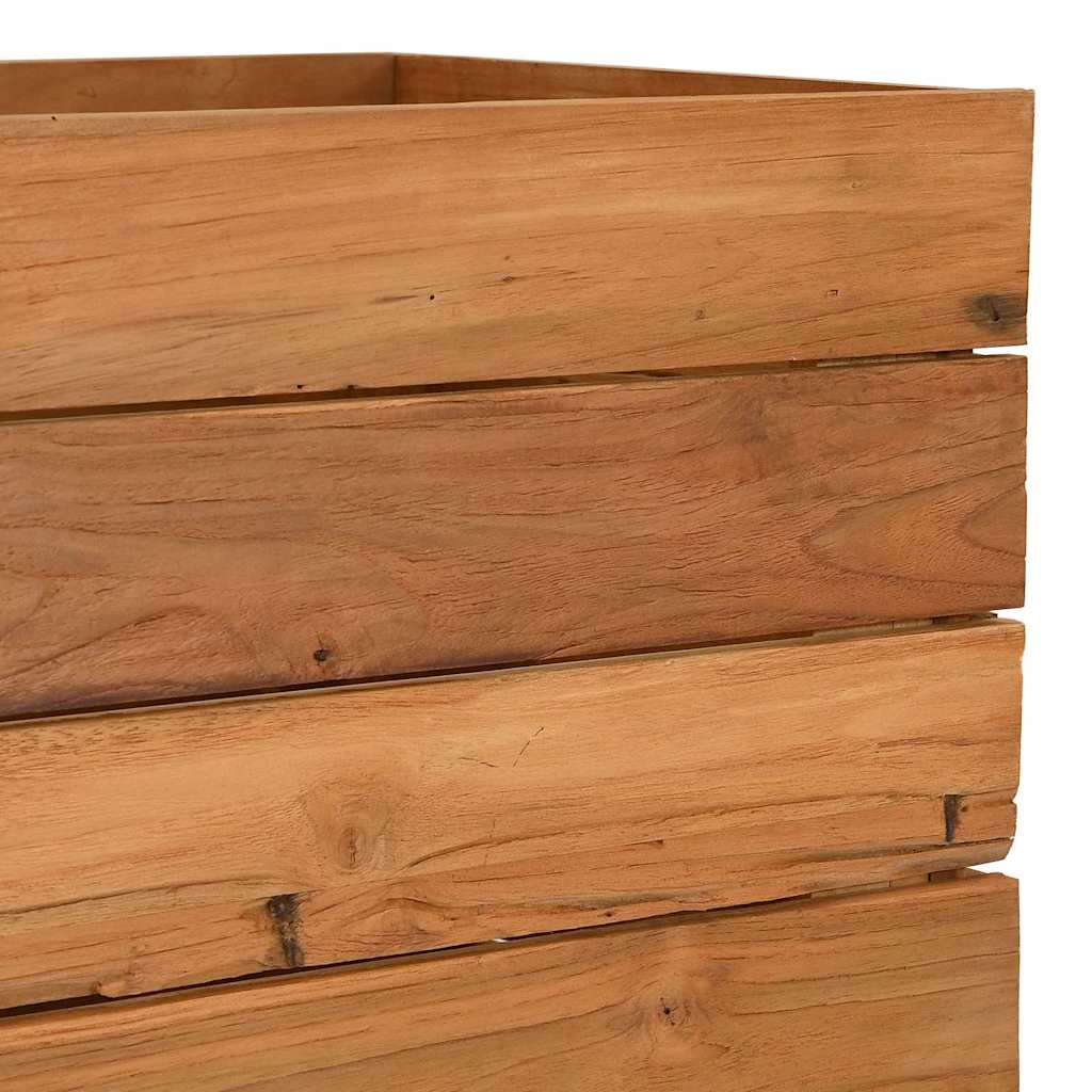 The raised bed close up of the weathered timber planks showing the natural texture and wood grain