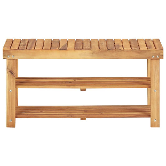 The shoe rack is made of solid acacia wood with a slatted top and two slatted shelves