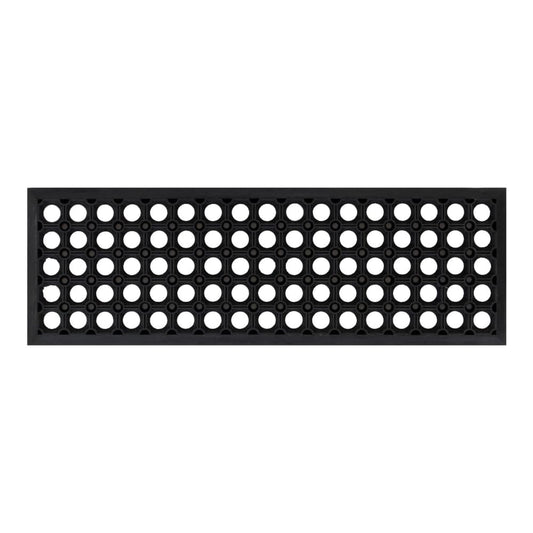 A single black rubber stair tread with a pattern of many small holes