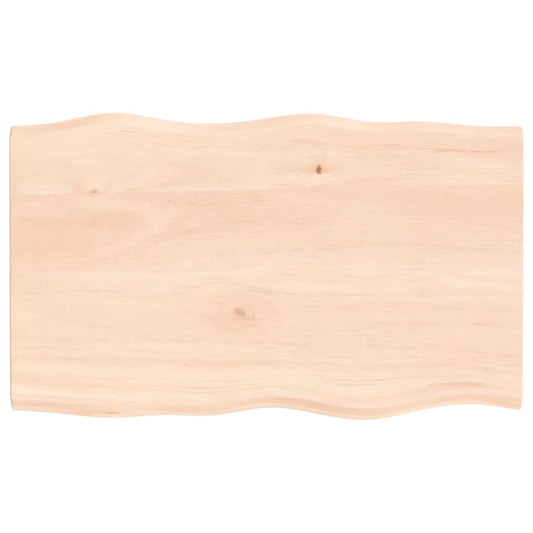 the table top shown from directly above displaying the natural wavy live edge design