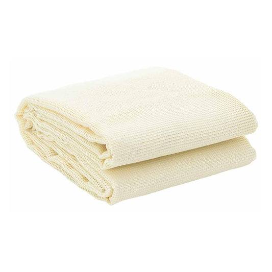 A cream coloured tent carpet folded neatly on top of itself