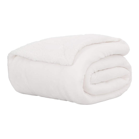 A white fleece throw blanket neatly rolled up on a white surface