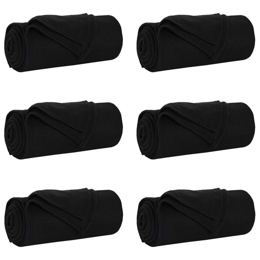 Six black fleece blankets rolled up and placed in a grid formation
