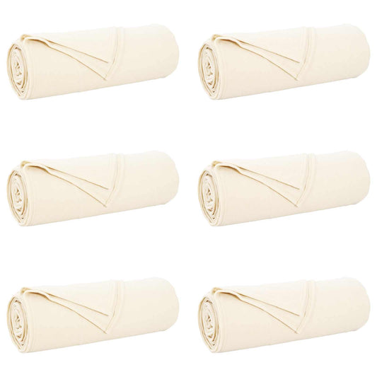 Six cream fleece blankets rolled up and arranged in two rows