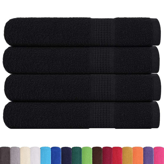 A selection of FROGN towels in various colours including black, grey, white, blue, green, red and yellow