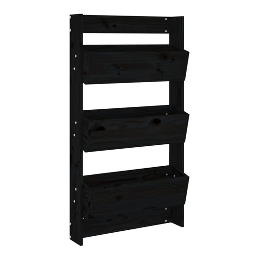 The black wooden wall planter with three tiers, shown empty