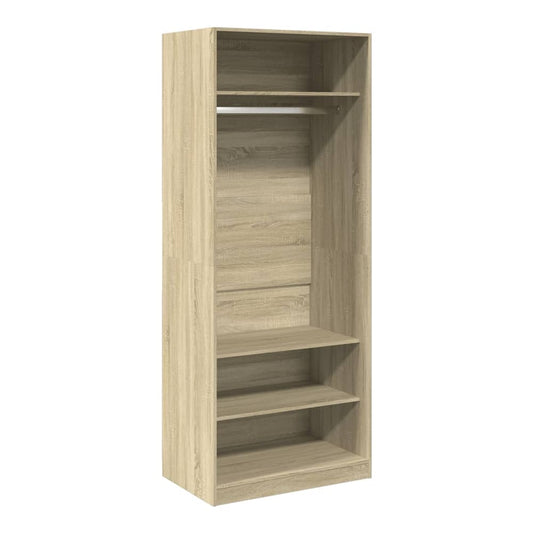 The open wardrobe with hanging rail and shelves, showing the interior