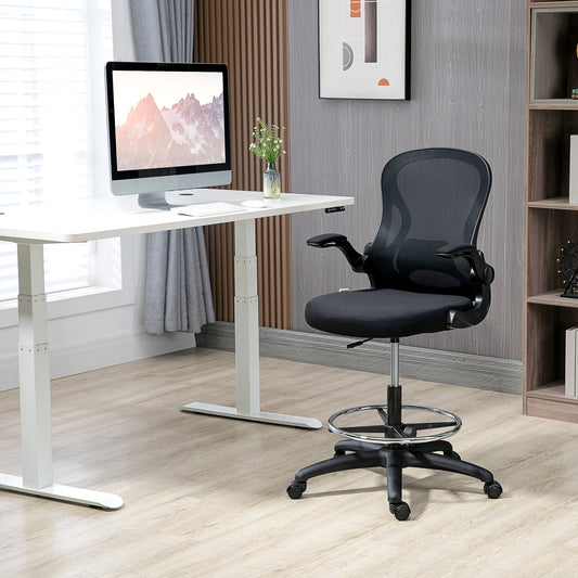 The black mesh office chair is shown next to a standing desk in a modern office setting