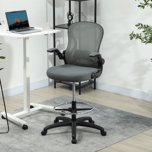 The tall office chair is shown next to a standing desk in a modern office setting