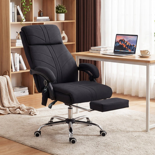 The black fabric office chair with footrest extended, shown in a home office setting