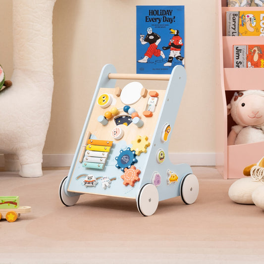 The blue wooden baby walker is placed in a child's room next to a bookshelf
