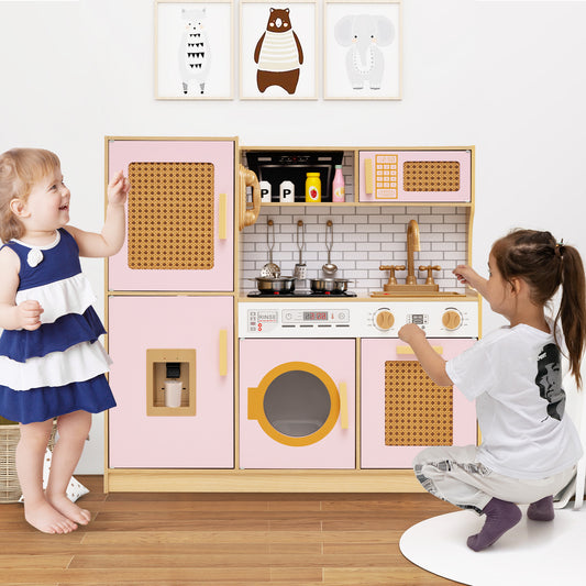 Two children playing with the pink wooden play kitchen set in a room