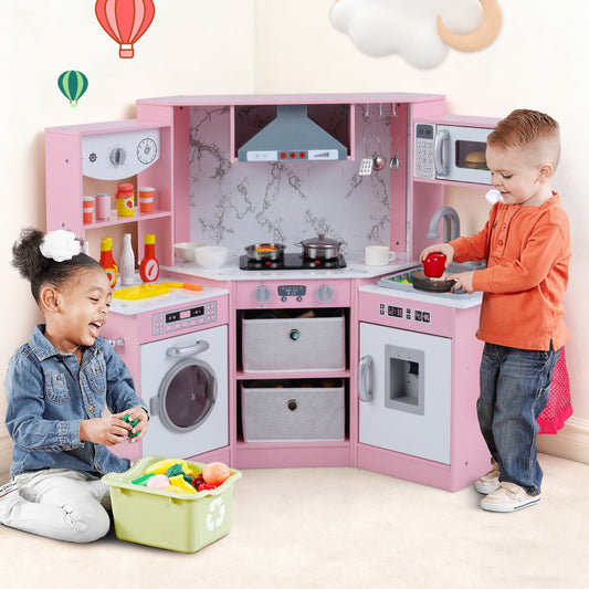 The play kitchen set being used by two children playing with food items in a room