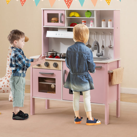 The play kitchen set being used by two children in a decorated room