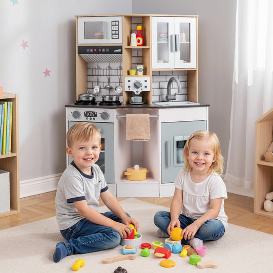 Two children playing with the wooden kitchen playset on the floor