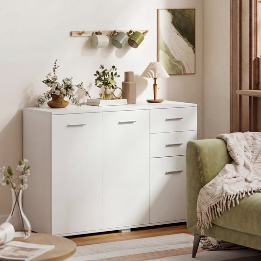 The storage cabinet placed in a living room next to a green sofa with decor on top