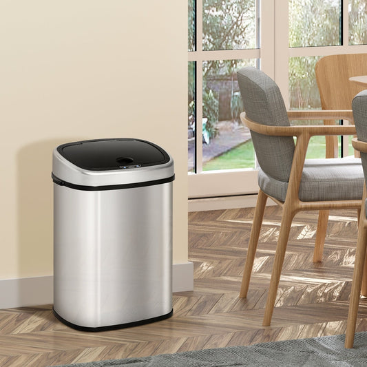 The stainless steel kitchen bin is shown in a dining room setting next to a table and chairs