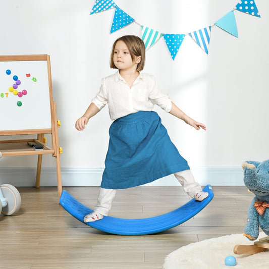 A young girl stands on the dark blue kids wobble board in a bright room