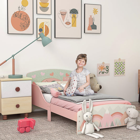 A young girl sitting on the pink toddler bed frame, which is in a child's bedroom with toys and a bedside table