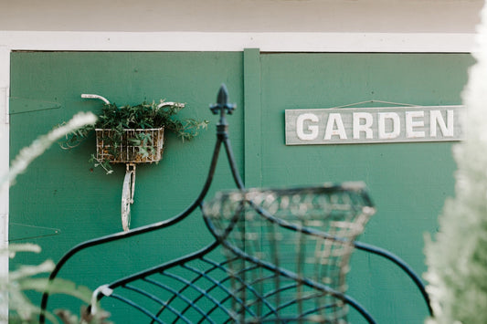 gray and white wooden garden signboard