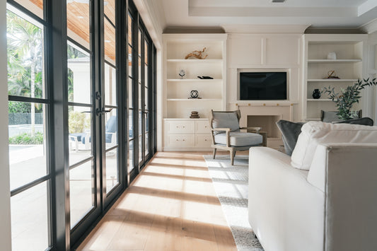 A living room filled with furniture and lots of windows