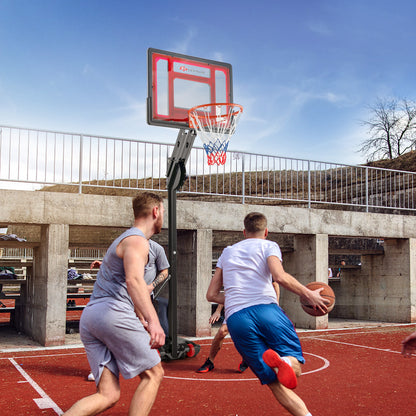 The adjustable basketball hoop is set up on an outdoor court with two men playing basketball