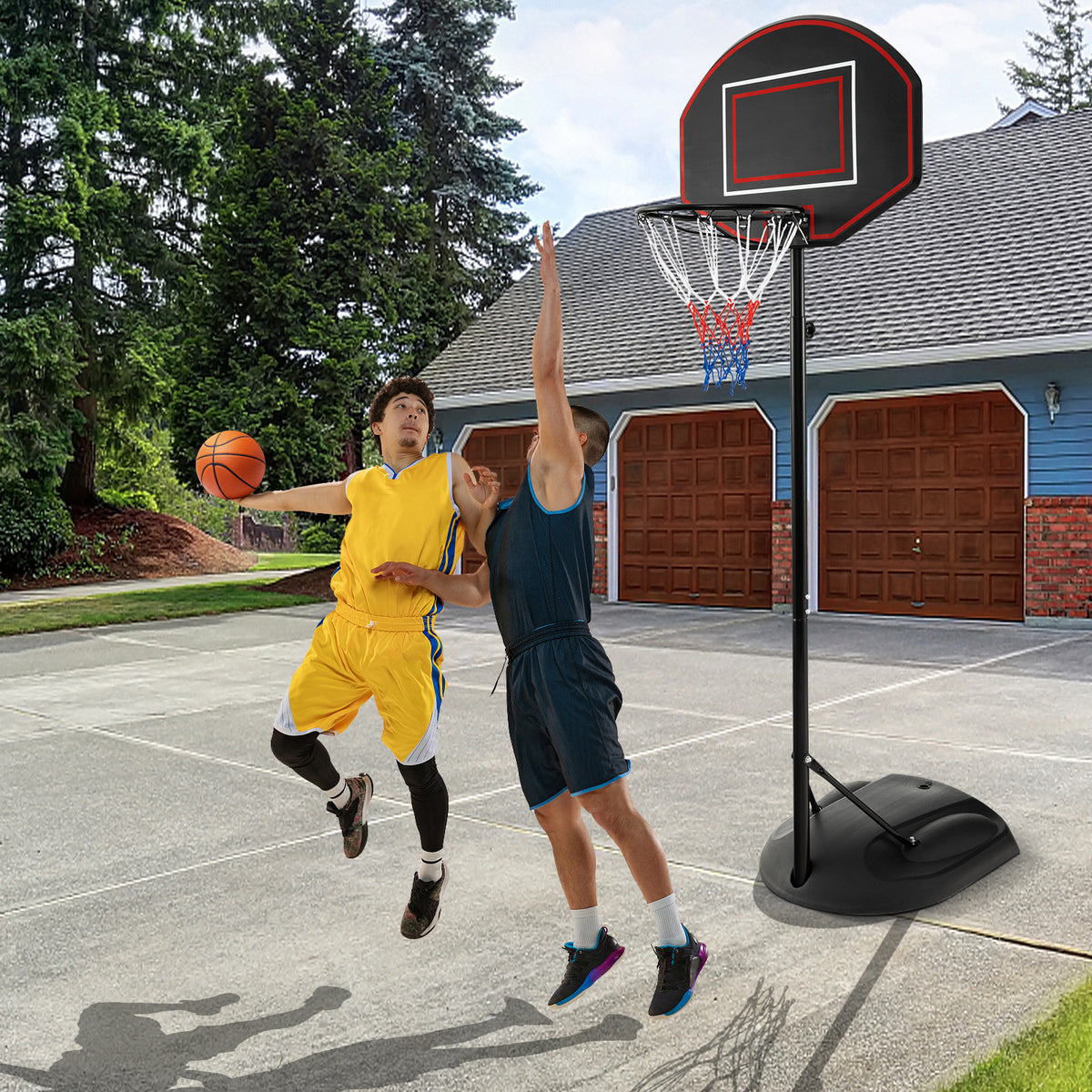 The sport equipment on a concrete court with two men playing a game of basketball