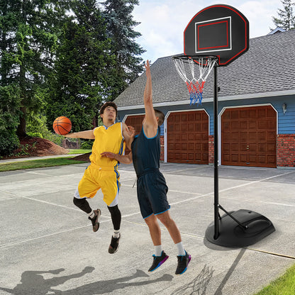 The sport equipment on a concrete court with two men playing a game of basketball
