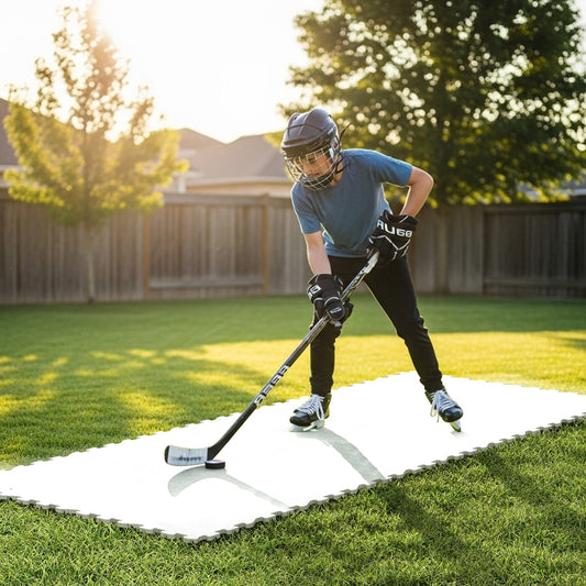 Young person practices hockey moves on a training tile surface laid on grass