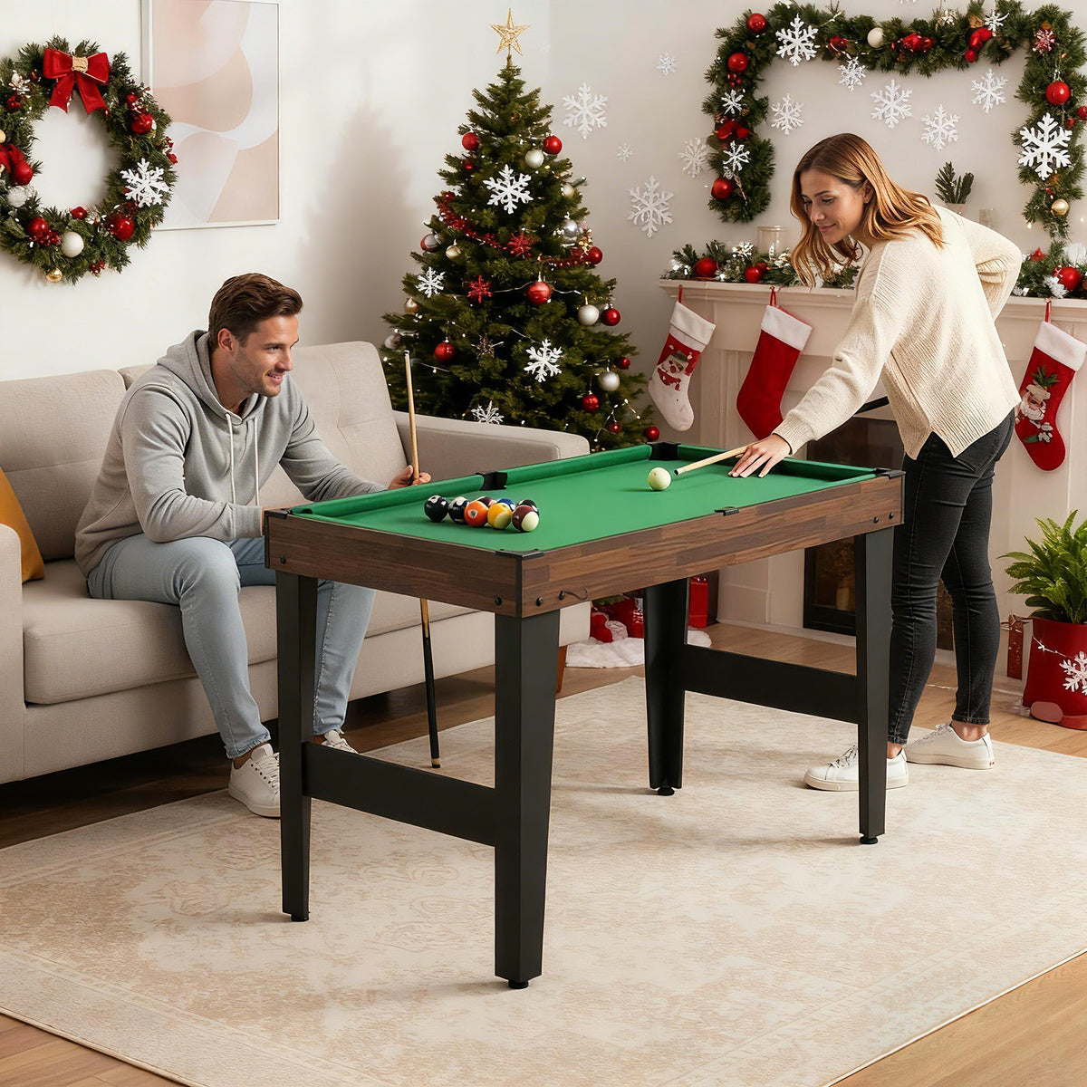 the game table set in a living room with people playing billiards during the festive season