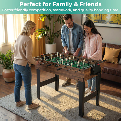 the game room table being used by two people playing foosball in a bright living space