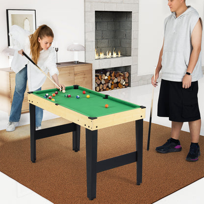 A girl and a boy play pool on the combo game table in a living room