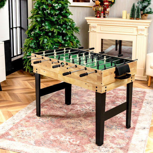 The game table standing on a patterned rug in a room decorated for Christmas