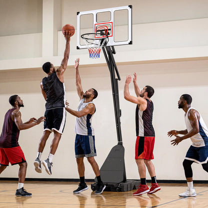 Group of men playing basketball indoors with the adjustable hoop