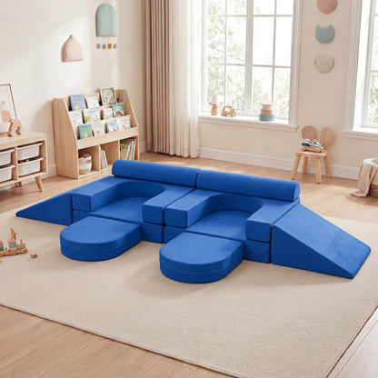Navy blue soft play set arranged in a long sofa shape with two children interacting with it