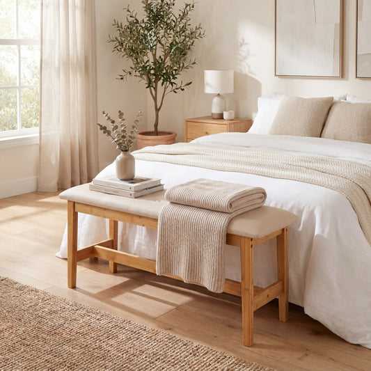 The bamboo bed bench in a bedroom setting at the foot of a bed