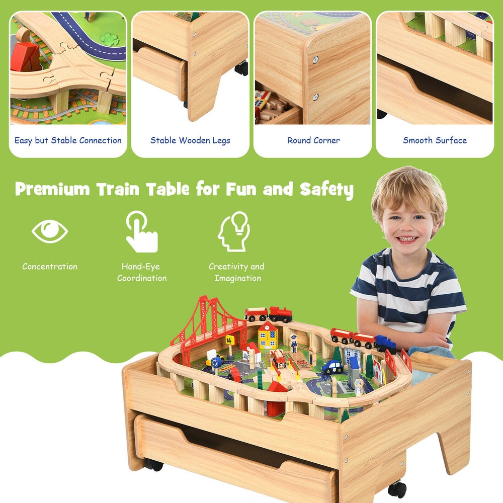 Close up of a smiling boy with the wooden train railway track set table