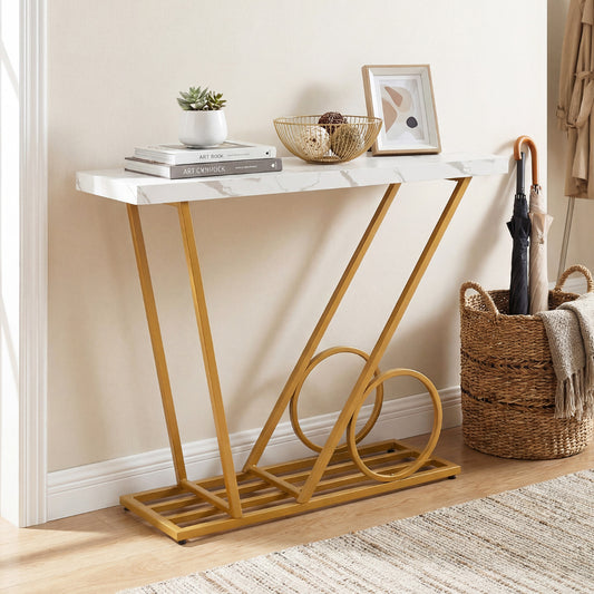 Console table with white marble effect top and gold frame in a hallway setting with basket and umbrella