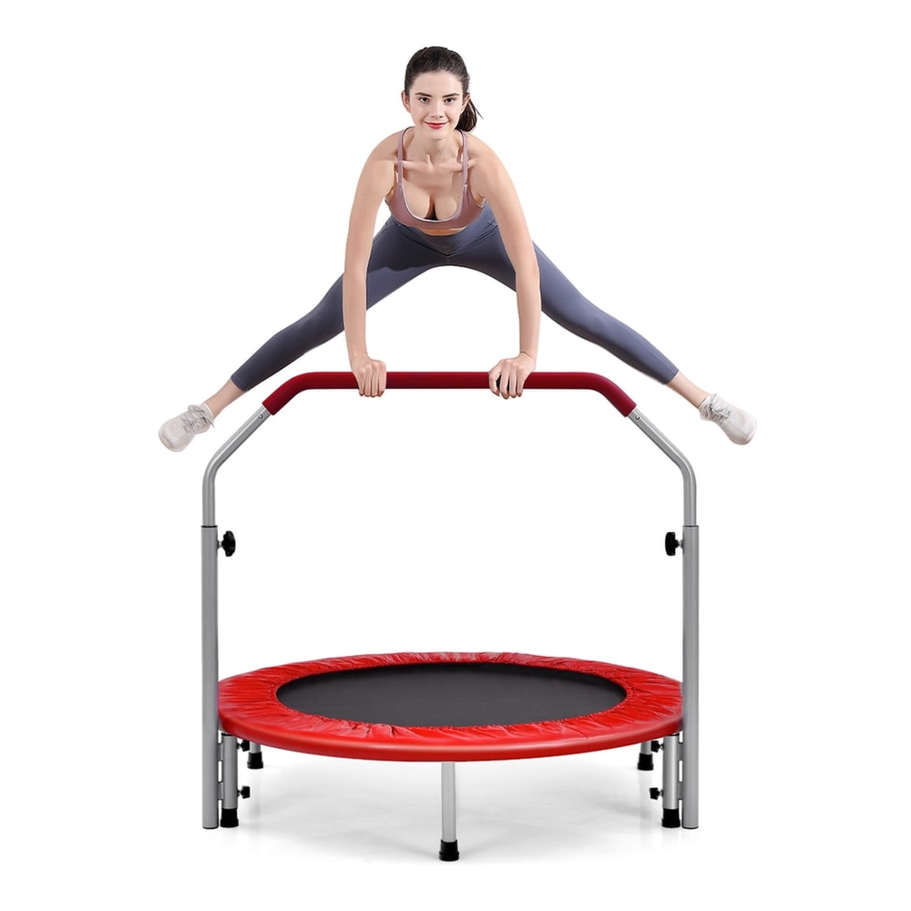 A woman holding the handle bars while jumping on the red trampoline