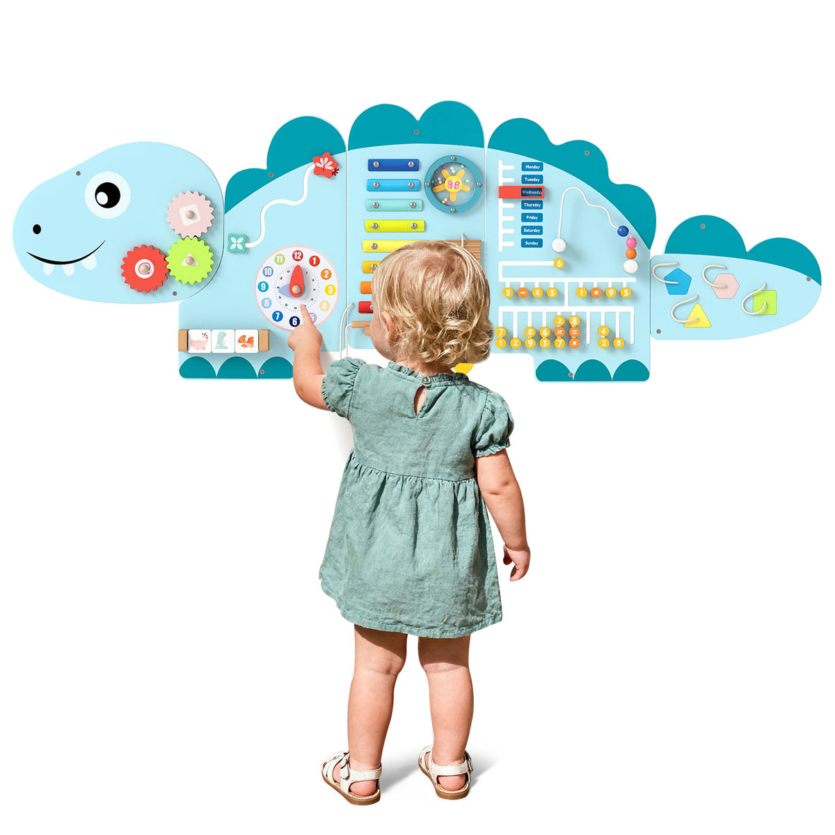 Rear view of a child interacting with the dinosaur activity wall busy board panels