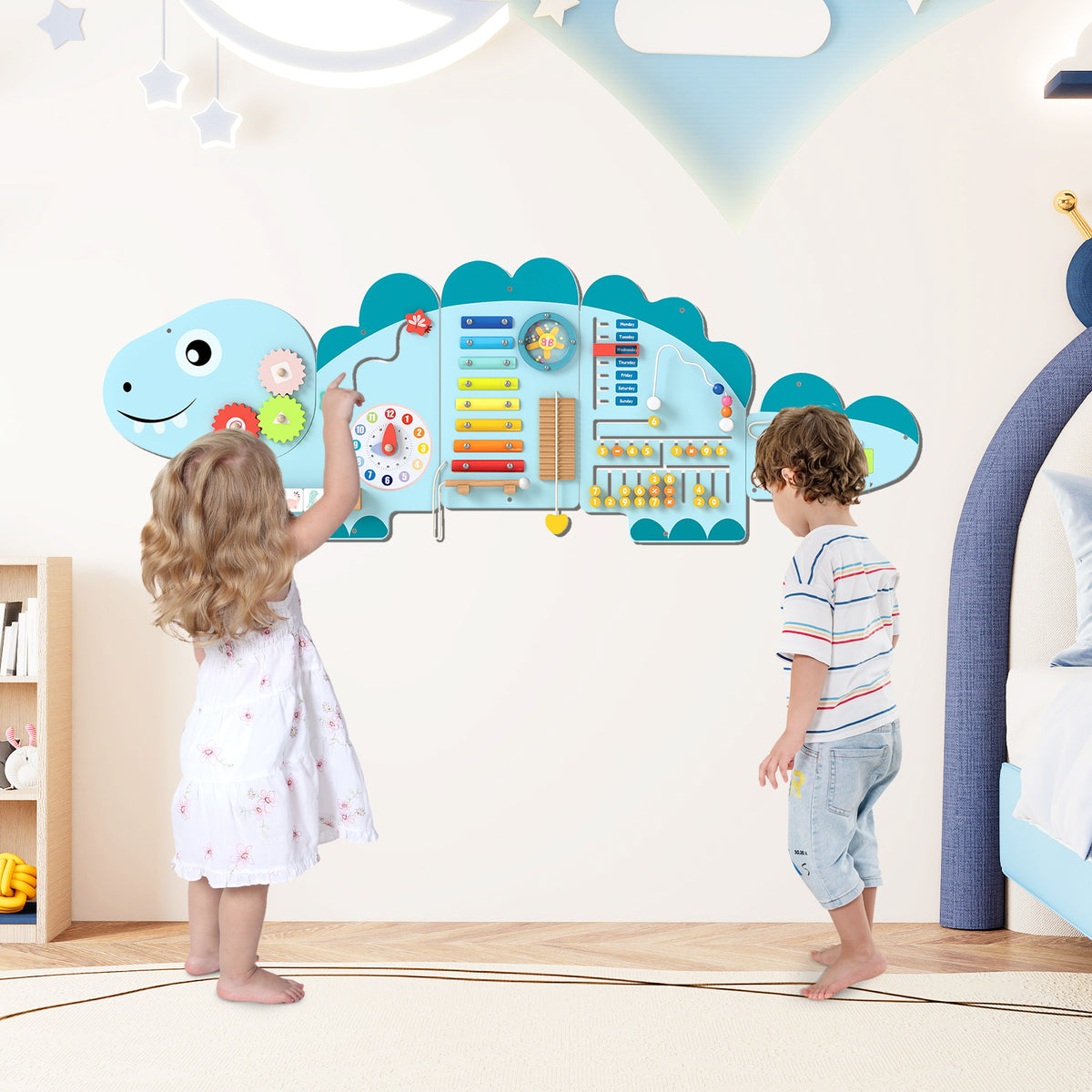 Toddlers playing with the dinosaur activity wall busy board panels mounted on a wall