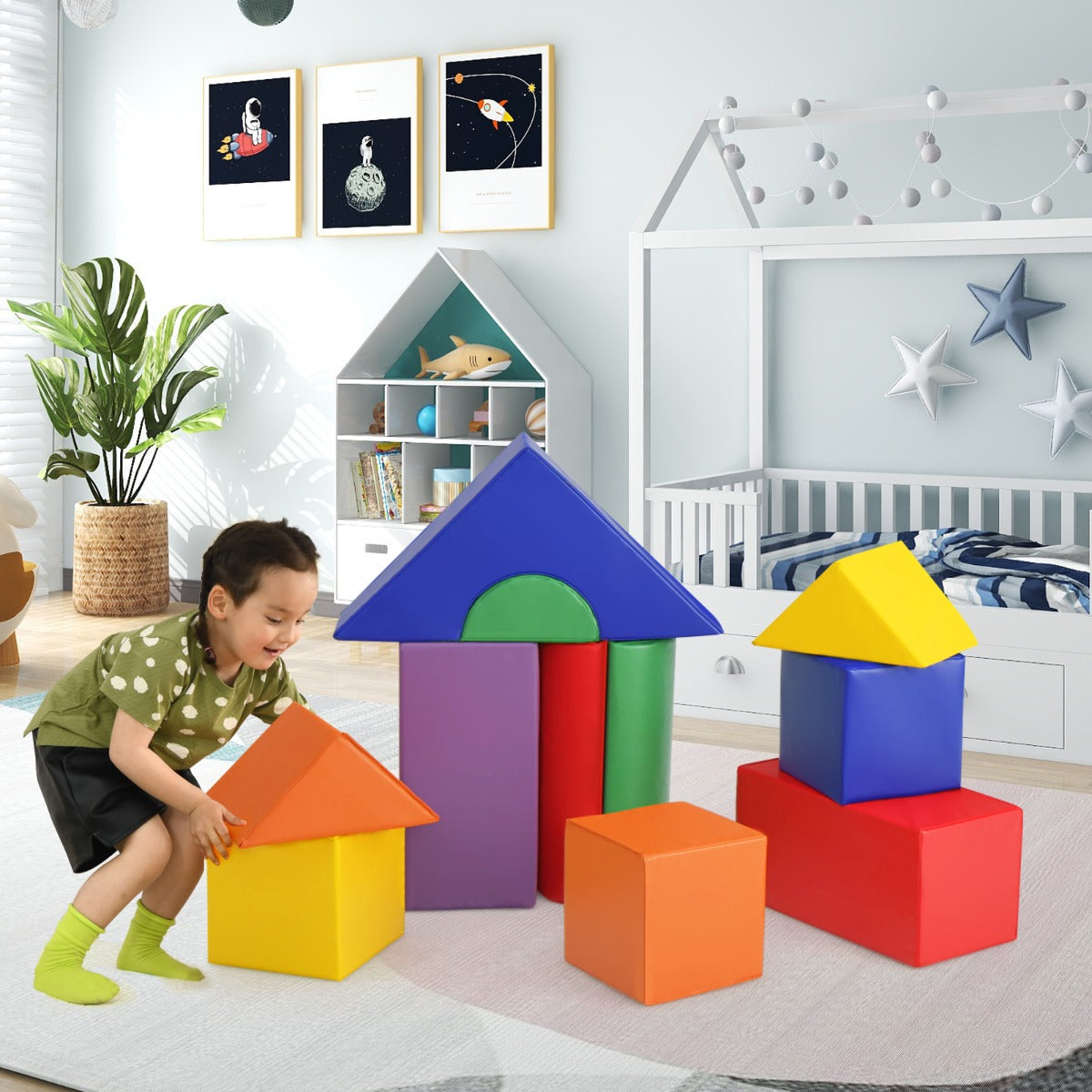 Young boy playing with the foam blocks in a nursery setting