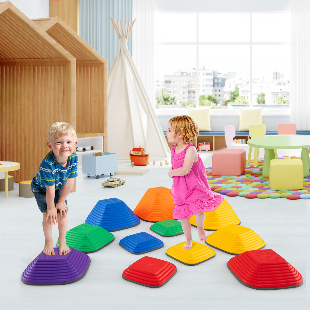 Children stand on stepping stones in a brightly lit playroom with soft furnishings