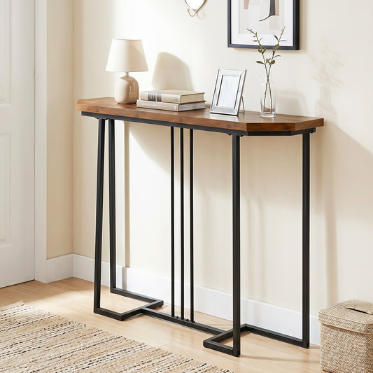 The console table is shown in a hallway with a lamp and picture frame on top